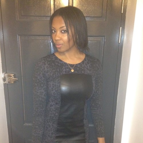 Young woman poses in a short dress.