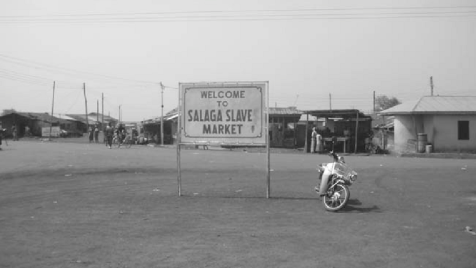 Black and white photograph of sign saying 'Welcome to Salaga Slave Market' © Katharina Schramm