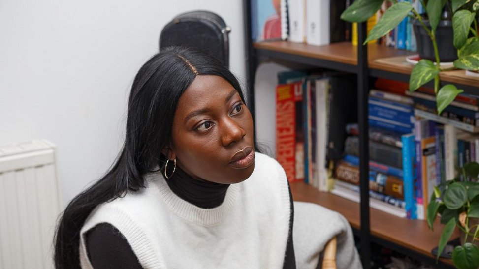 Black woman looking thoughtful