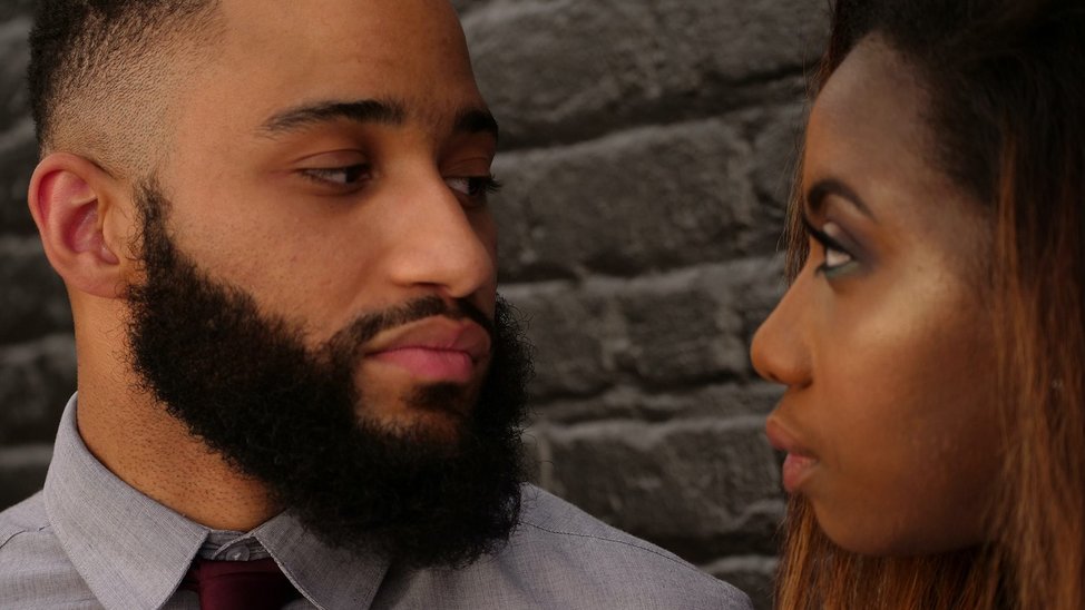 Black couple looking at each other